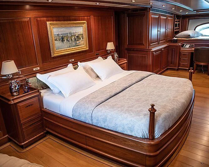a bed in a room aboard ATHOS Yacht for Sale