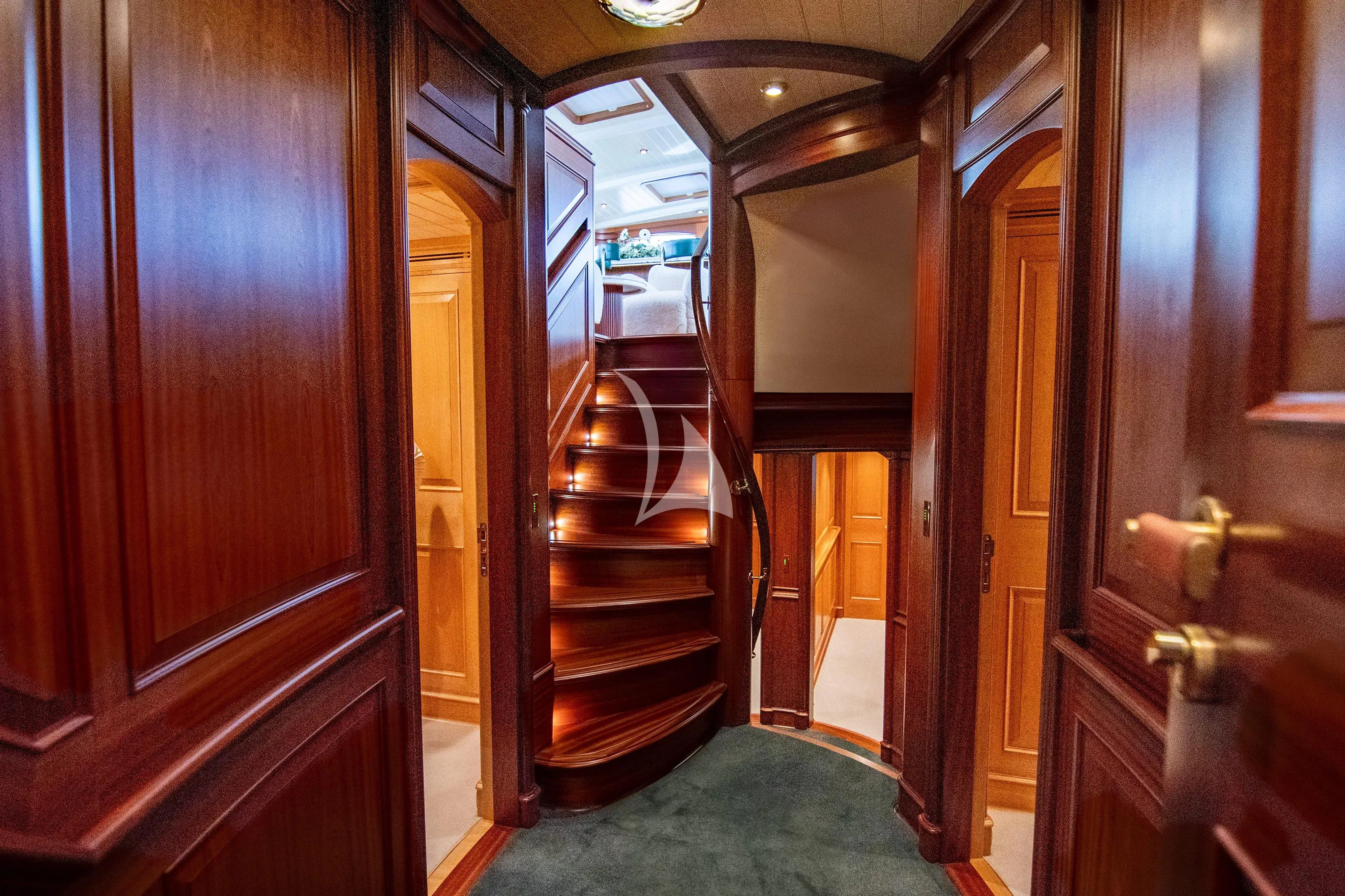 a hallway with wood doors aboard ATHOS Yacht for Sale