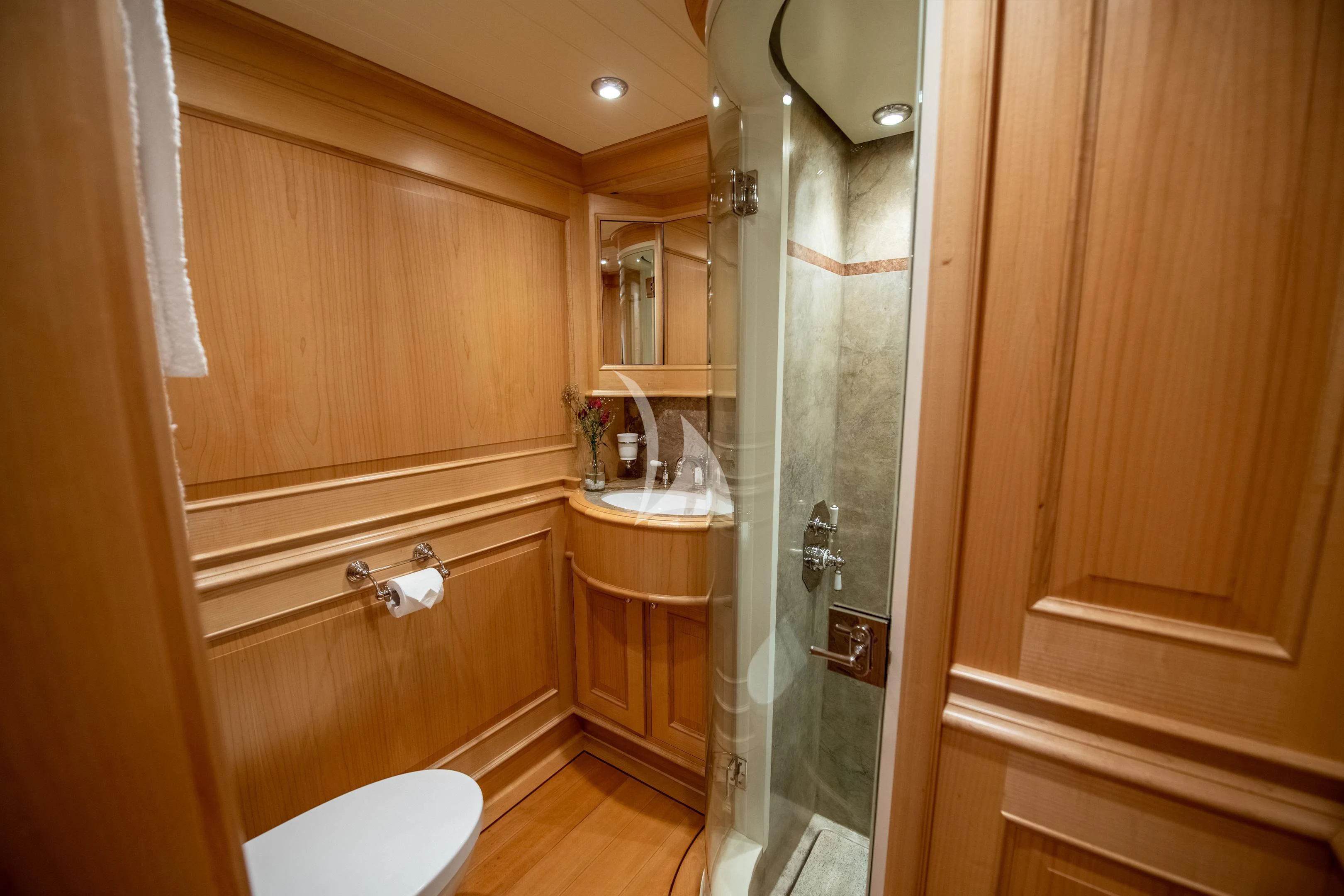 a bathroom with a glass shower aboard ATHOS Yacht for Sale
