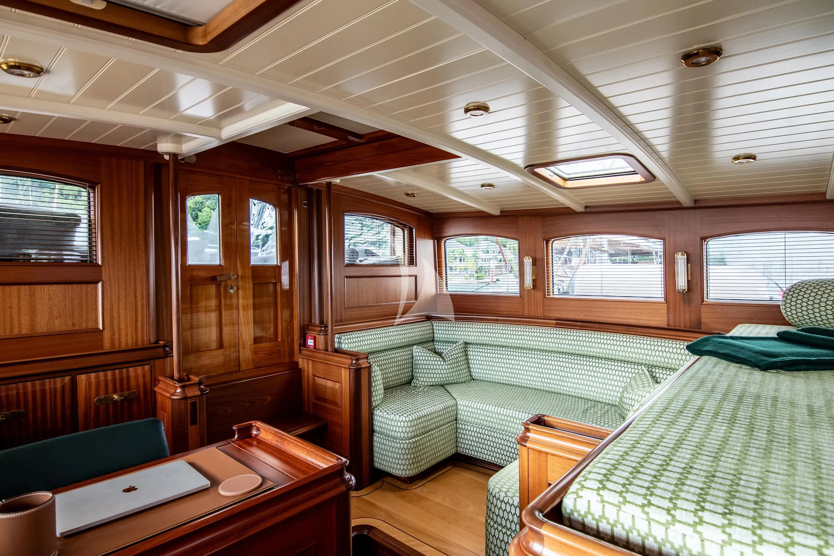 a room with a couch and a table aboard ATHOS Yacht for Sale