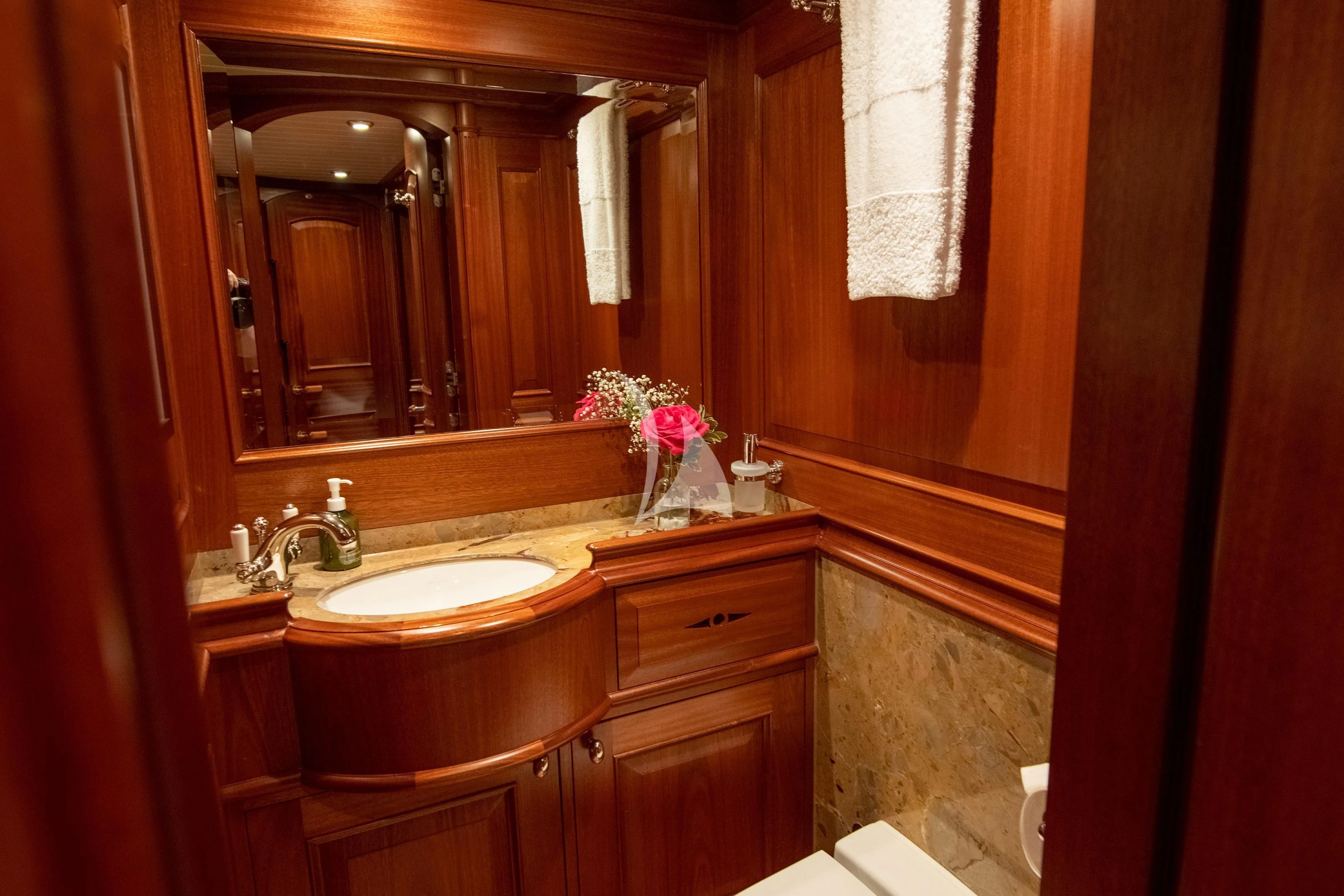 a bathroom with a large mirror aboard ATHOS Yacht for Sale