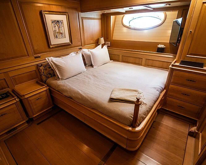 a bed in a room aboard ATHOS Yacht for Sale