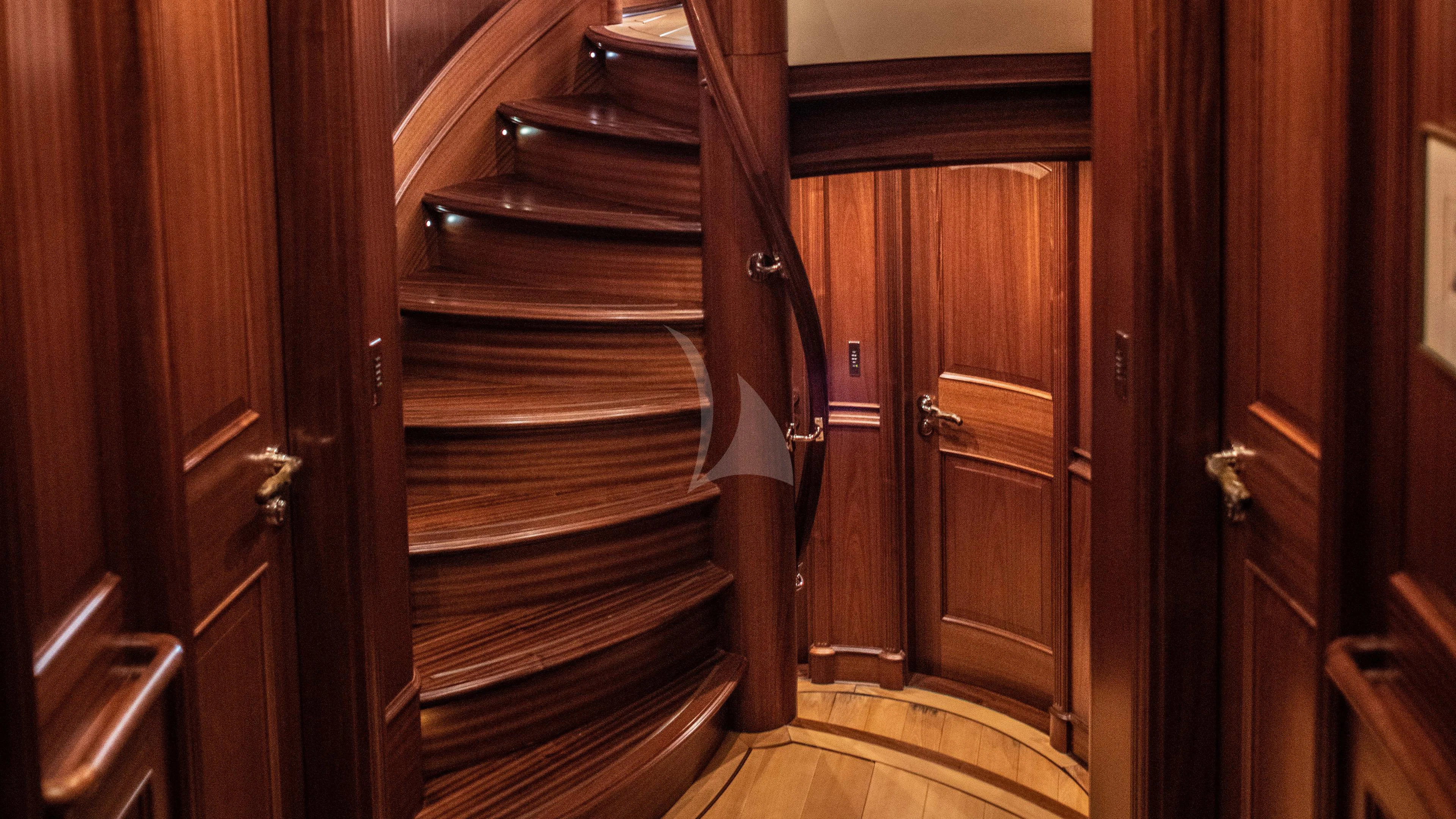 a wooden staircase in a room aboard ATHOS Yacht for Sale