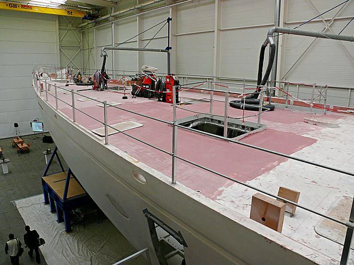 a large white table with a red center aboard ATHOS Yacht for Sale