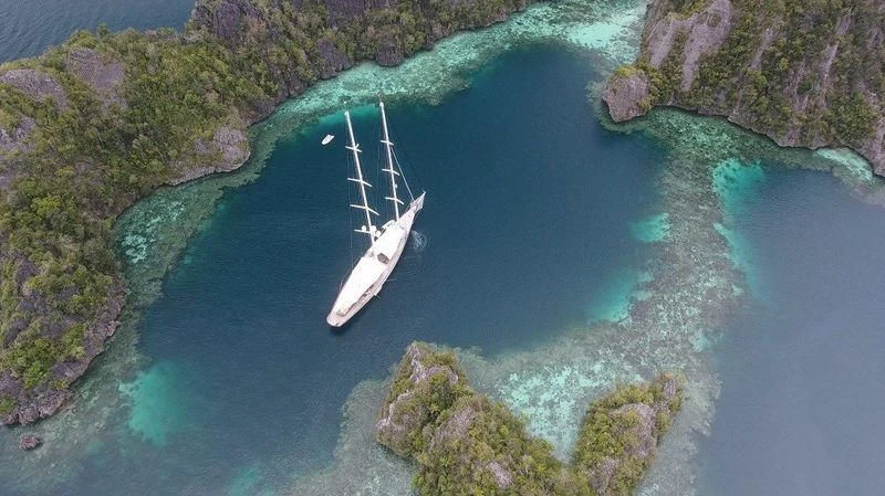 a boat sailing in the water aboard ATHOS Yacht for Sale