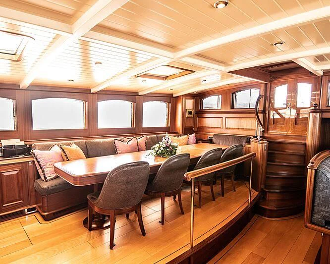 a living room with a staircase aboard ATHOS Yacht for Sale