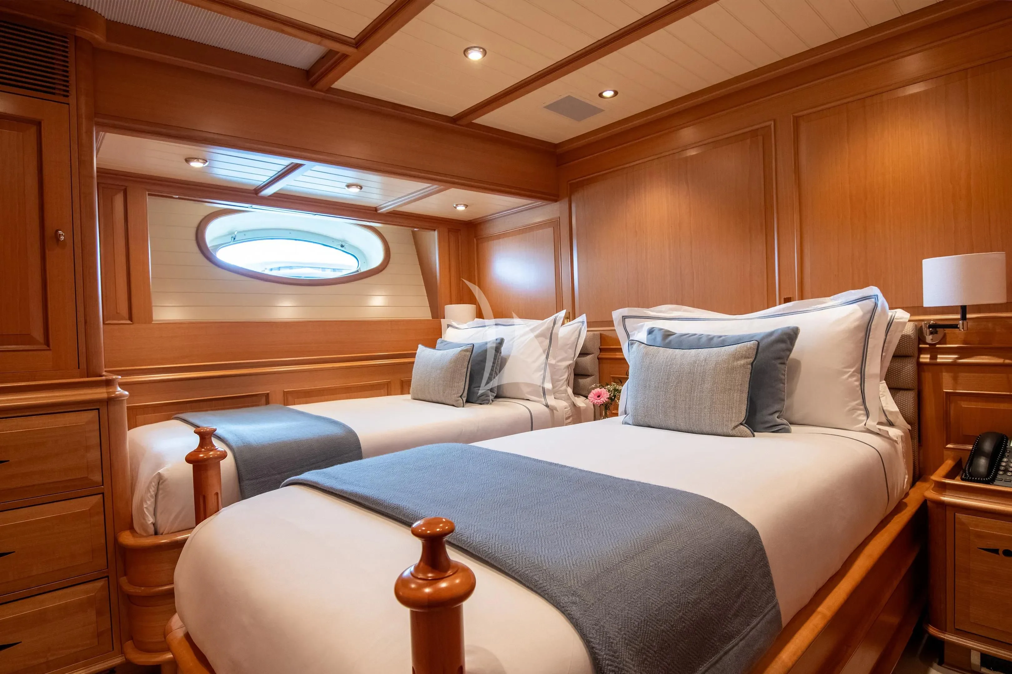a room with a bed and a window aboard ATHOS Yacht for Sale