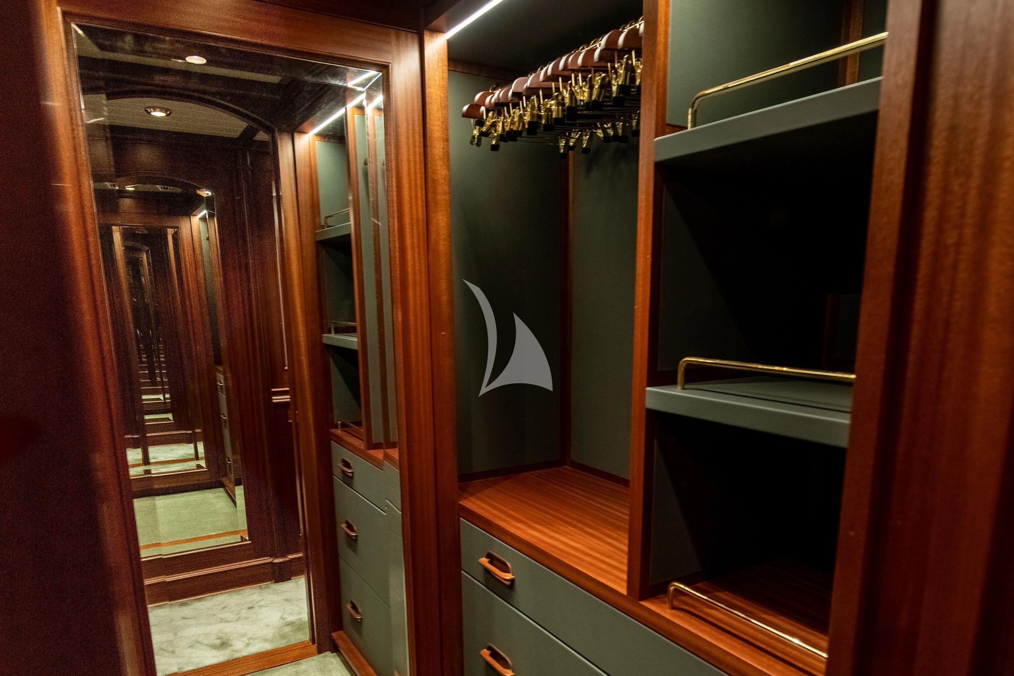 a room with a door and a mirror aboard ATHOS Yacht for Sale
