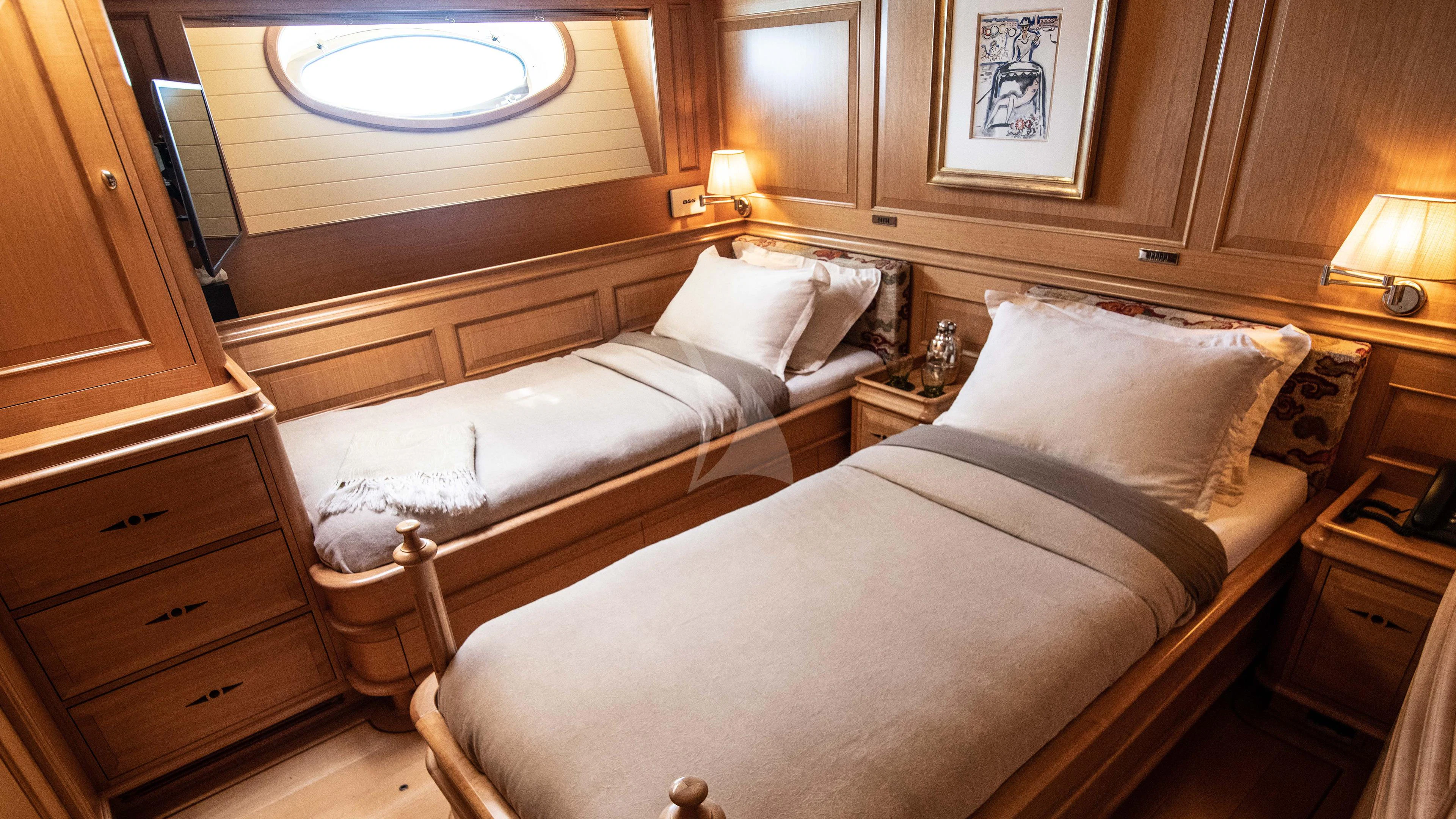 a room with two beds aboard ATHOS Yacht for Sale