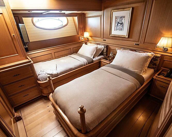 a room with two beds aboard ATHOS Yacht for Sale