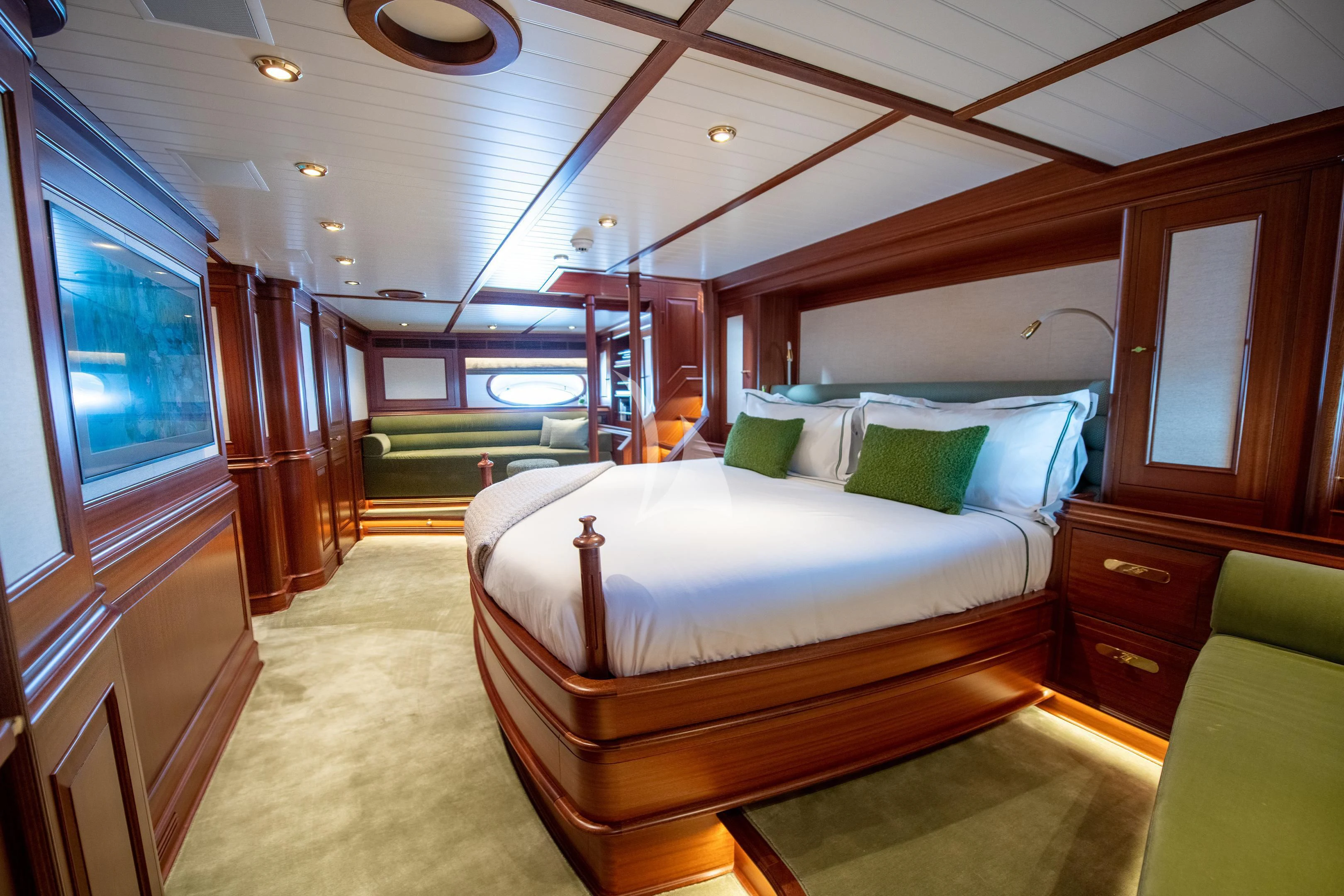 a bedroom with a bed and a window aboard ATHOS Yacht for Sale