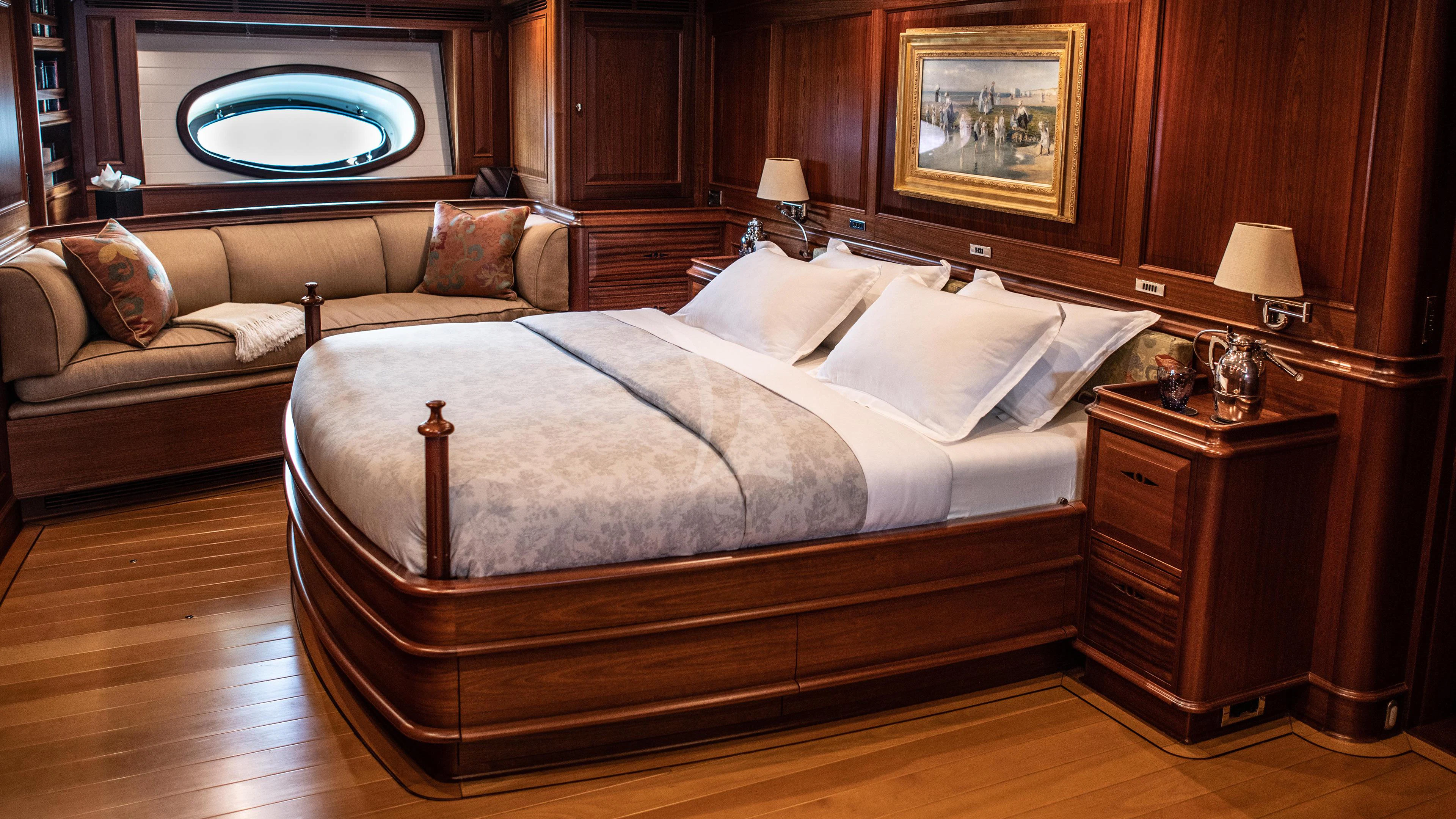 a bed in a room aboard ATHOS Yacht for Sale