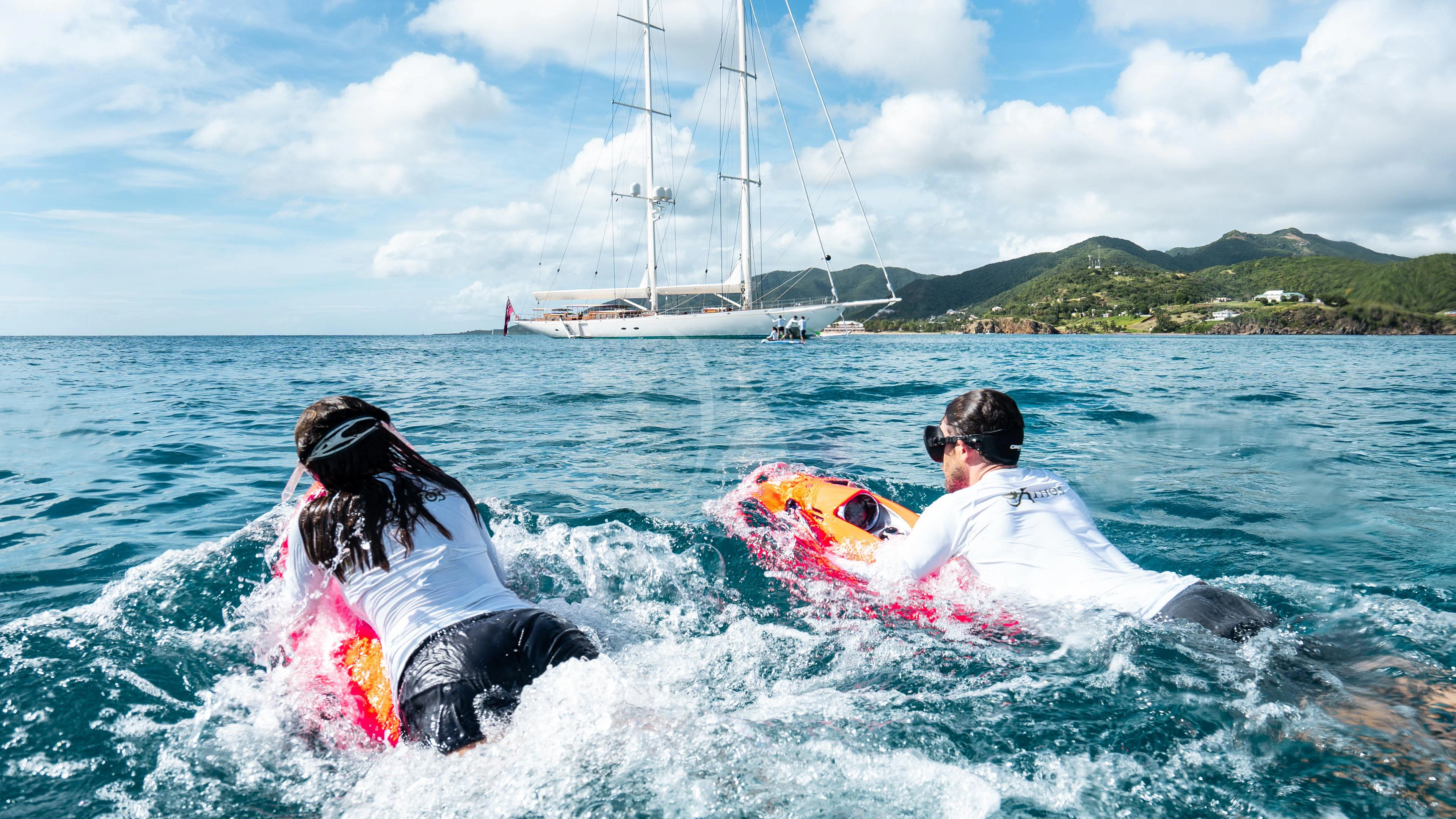 a man and woman in the water aboard ATHOS Yacht for Sale