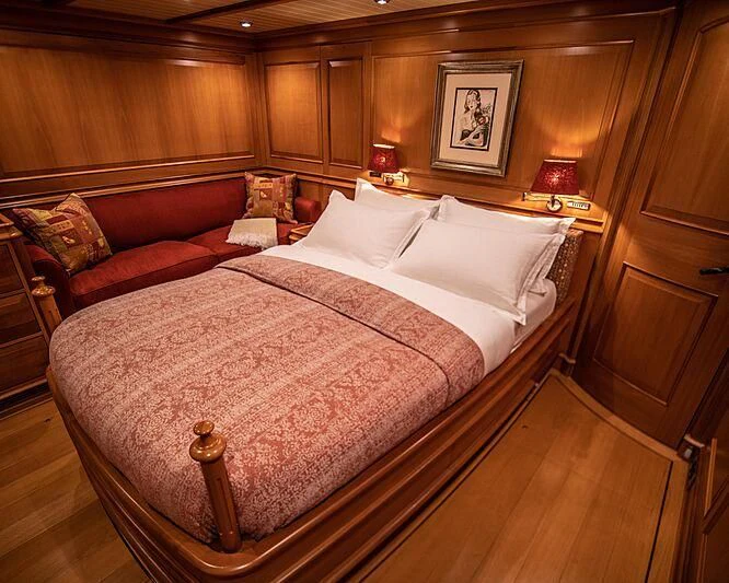 a bed in a room aboard ATHOS Yacht for Sale