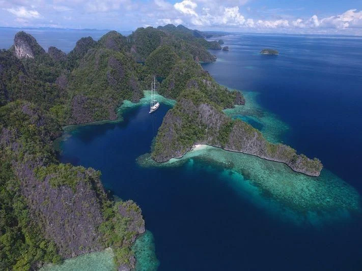 a small island in the middle of a body of water aboard ATHOS Yacht for Sale