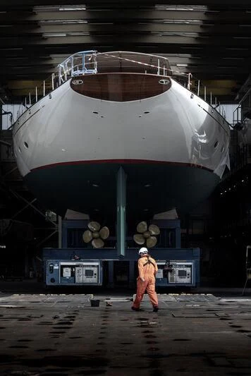 a person standing in front of a space ship aboard ATHOS Yacht for Sale