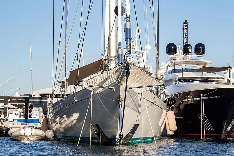 a few boats are parked in the water aboard ATHOS Yacht for Sale