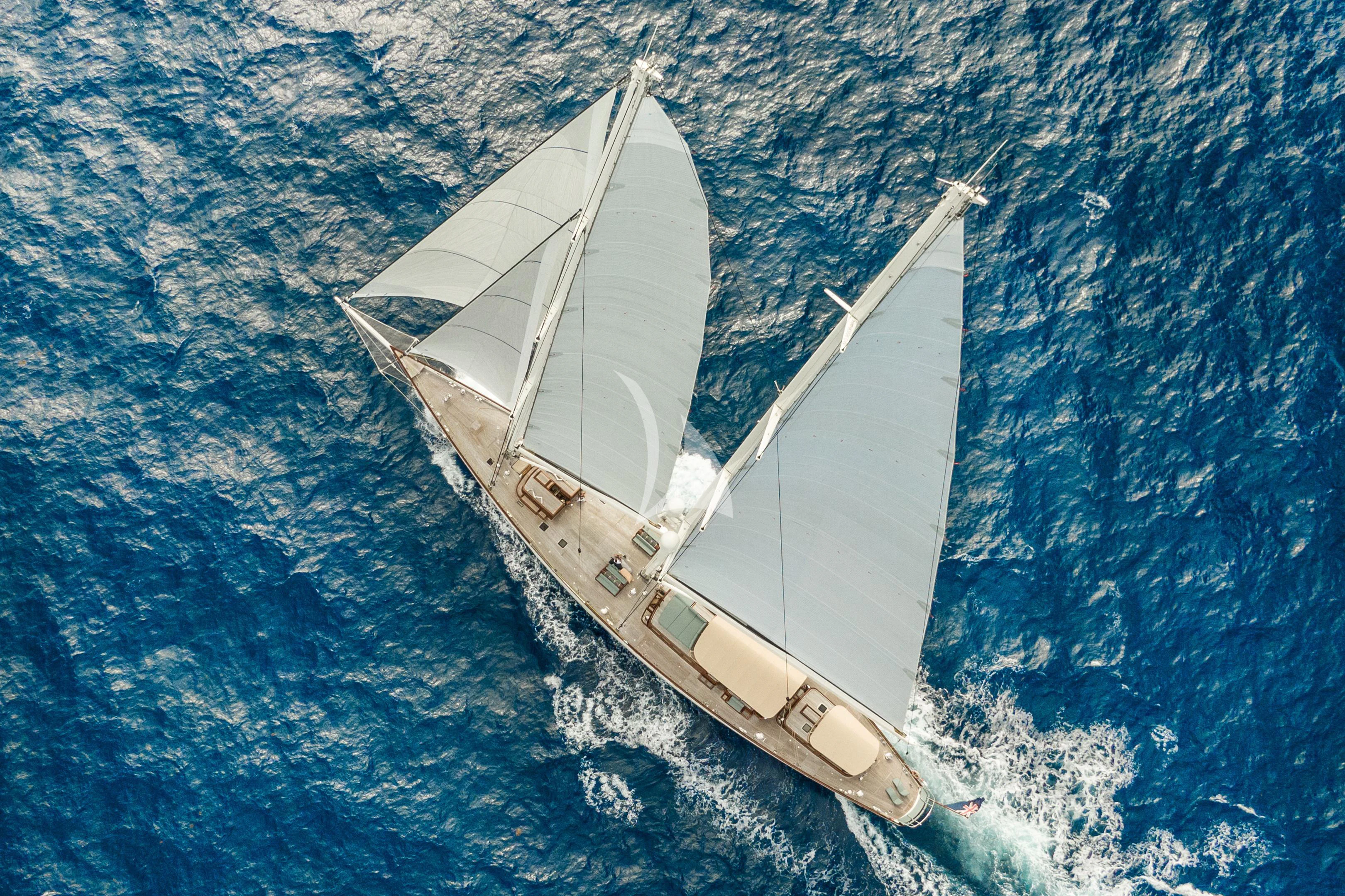 a white boat in the water aboard ATHOS Yacht for Sale
