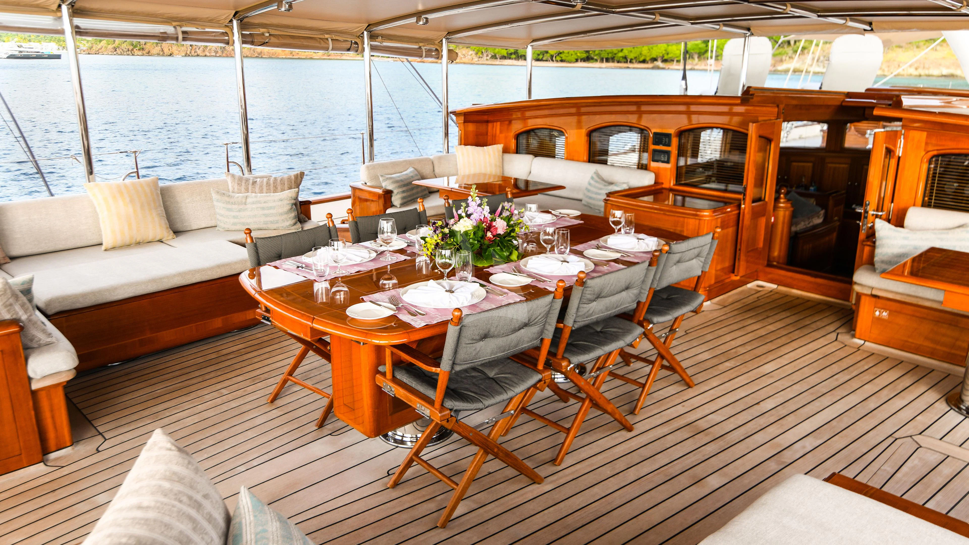 a table set for a meal on a boat aboard ATHOS Yacht for Sale