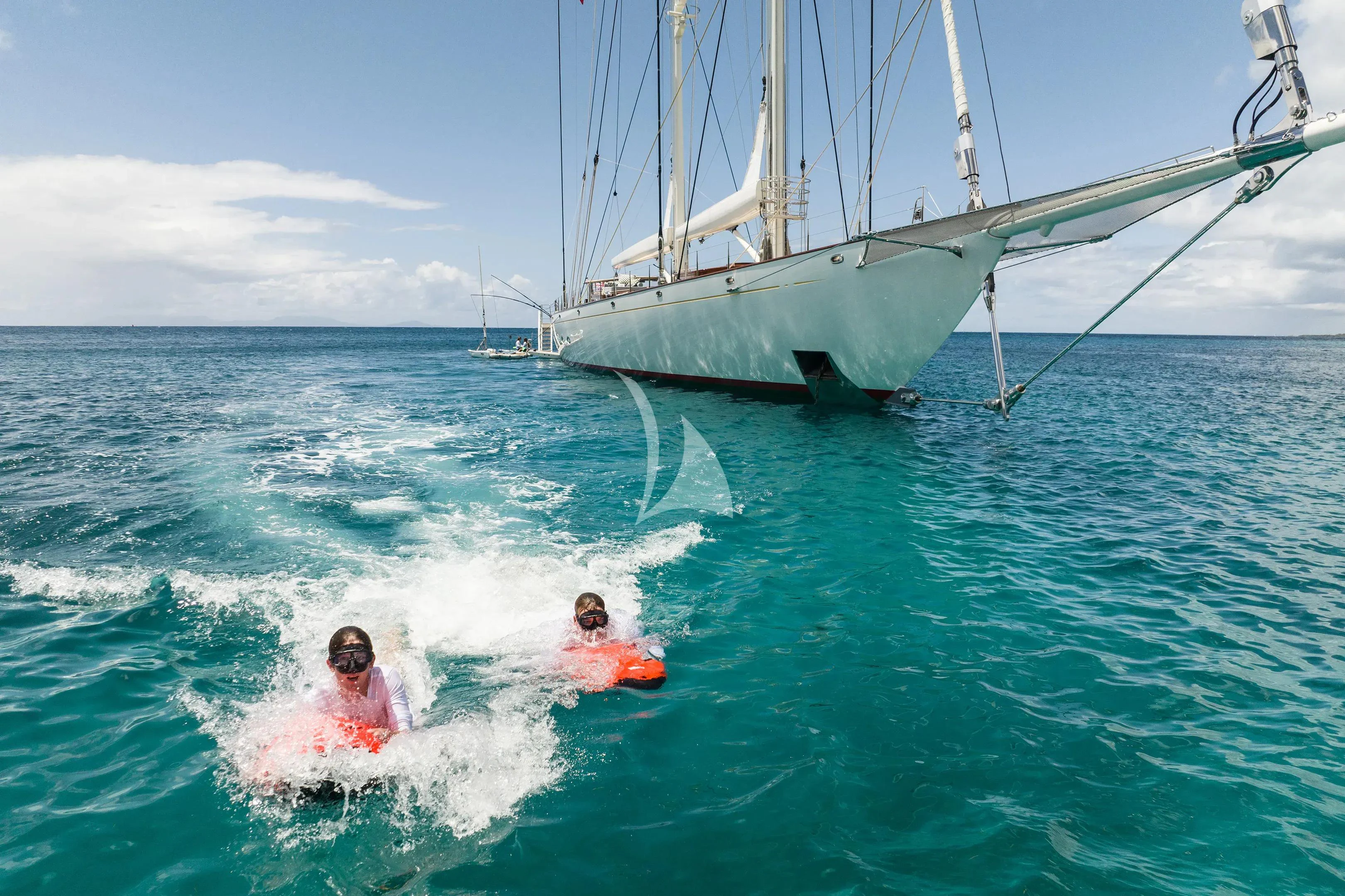 a couple of kids in a sailboat aboard ATHOS Yacht for Sale