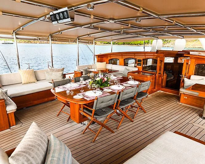 a room with a table and chairs aboard ATHOS Yacht for Sale