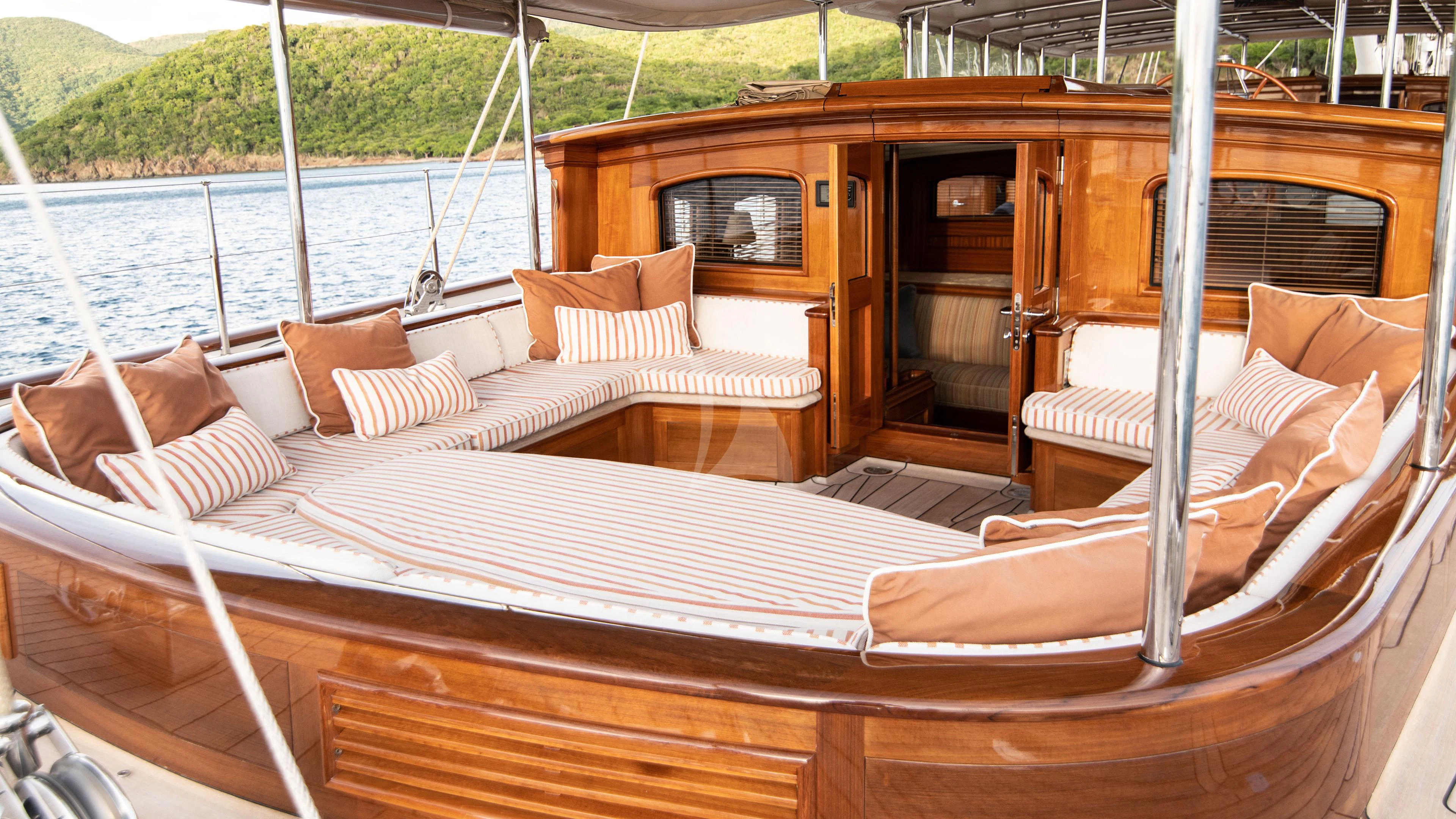 a bed with pillows on it aboard ATHOS Yacht for Sale