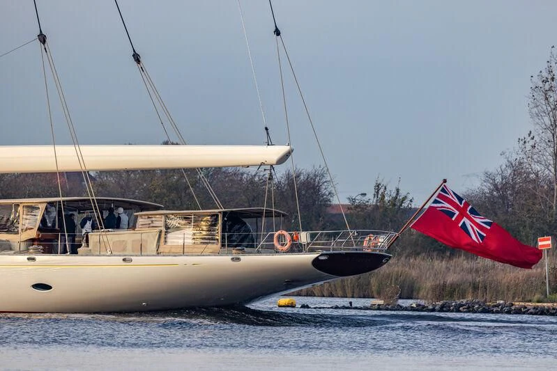 a boat with a flag on the front aboard ATHOS Yacht for Sale