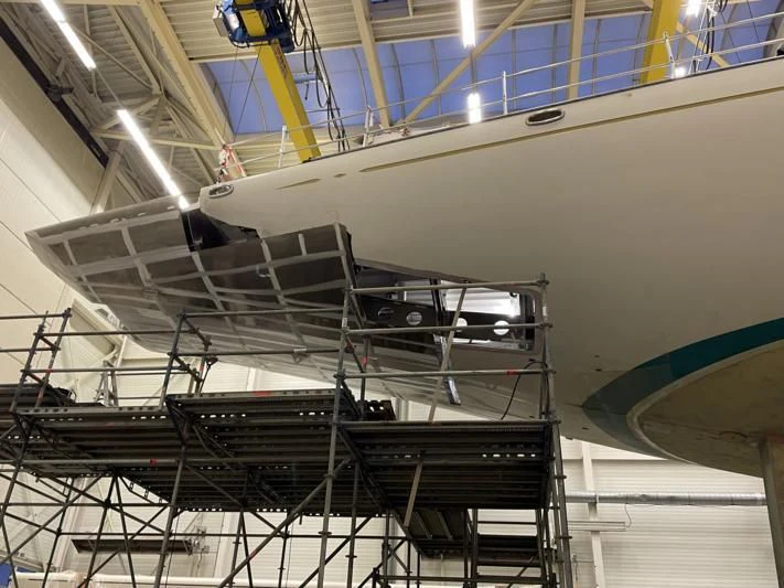 a large white airplane in a building aboard ATHOS Yacht for Sale