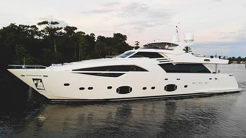 a white yacht on the water aboard MACQNDO Yacht for Sale