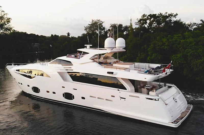 a white yacht on a river aboard MACQNDO Yacht for Sale