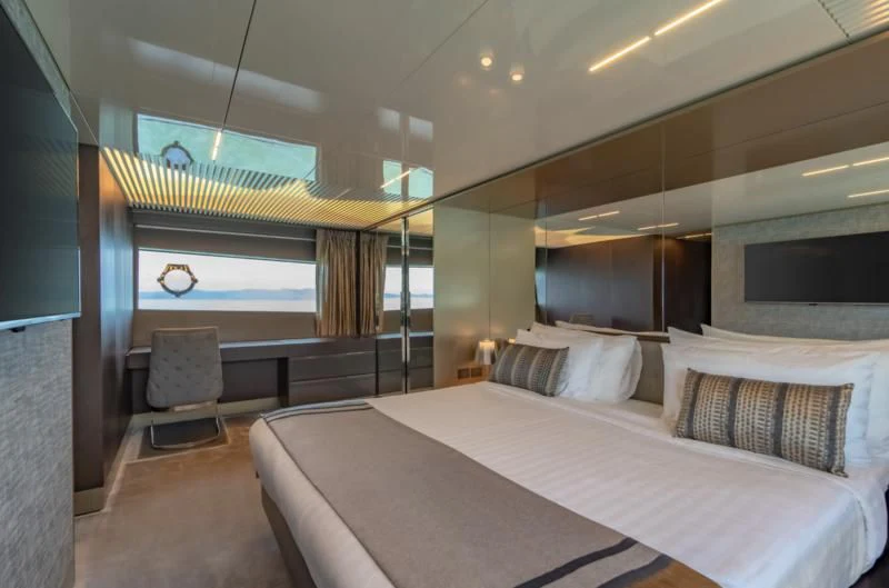 a large bed in a room aboard ORIANT Yacht for Sale