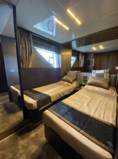a room with a couple of beds aboard ORIANT Yacht for Sale