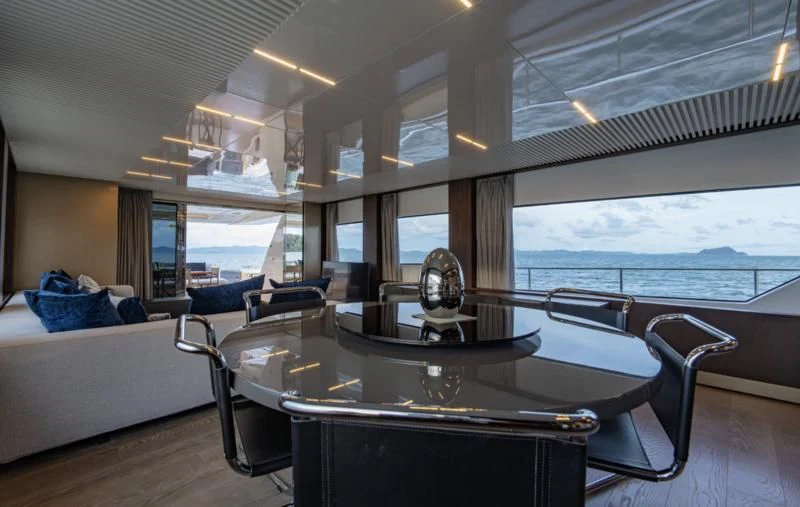 a room with a table and chairs aboard ORIANT Yacht for Sale