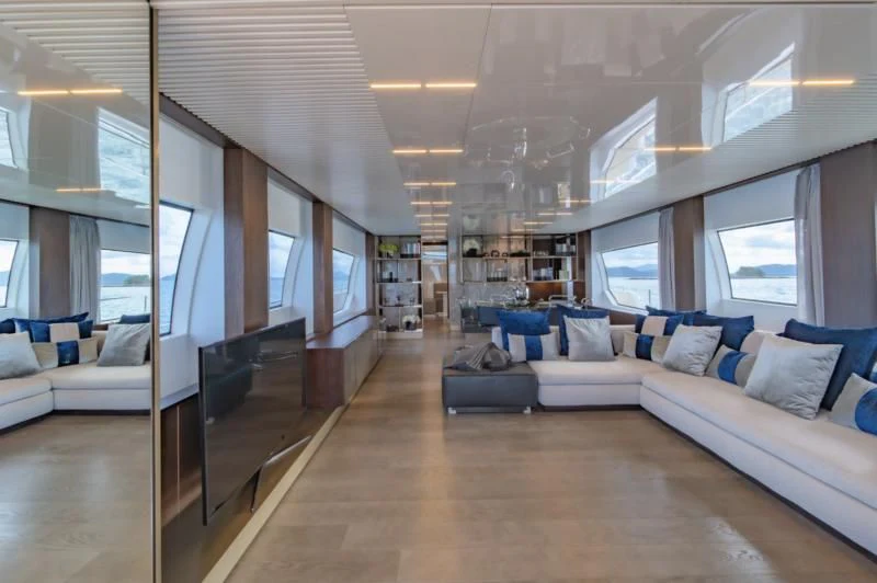 a living room with a large window aboard ORIANT Yacht for Sale