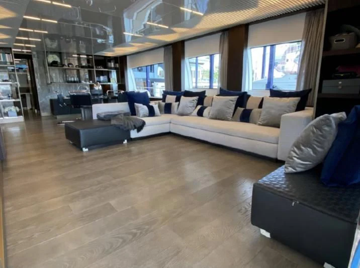 a living room with a large window aboard ORIANT Yacht for Sale