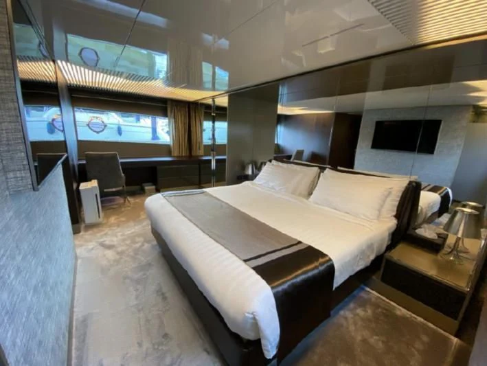 a room with a bed and a tv aboard ORIANT Yacht for Sale