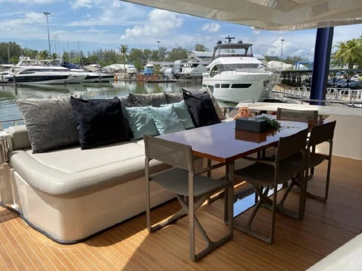 a table and chairs on a deck aboard ORIANT Yacht for Sale