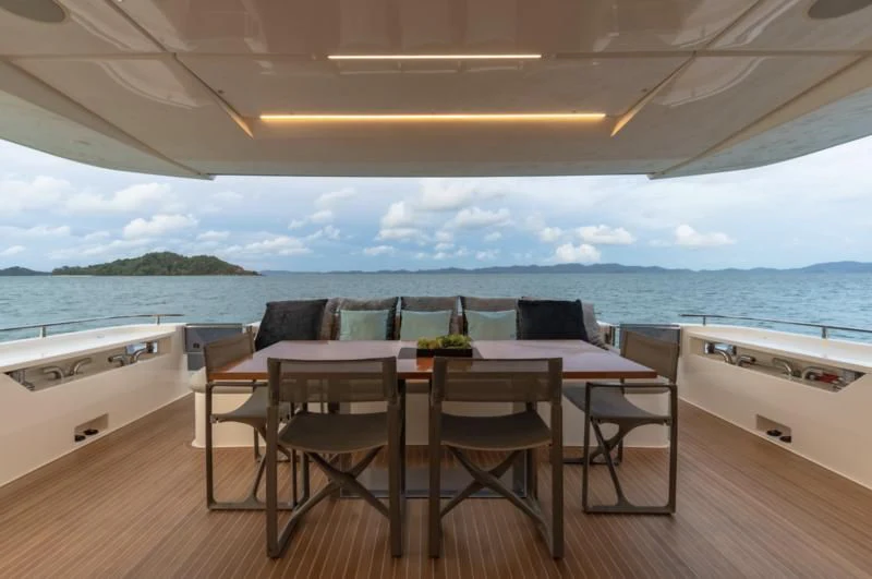 a table and chairs on a deck aboard ORIANT Yacht for Sale