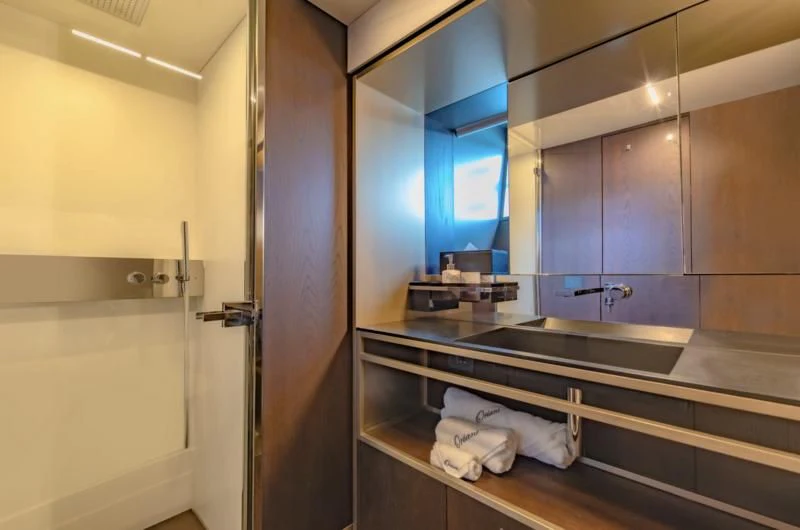 a bathroom with a countertop sink and a mirror aboard ORIANT Yacht for Sale