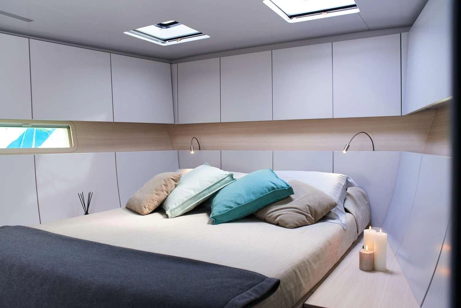 a bed with pillows aboard AORI Yacht for Sale