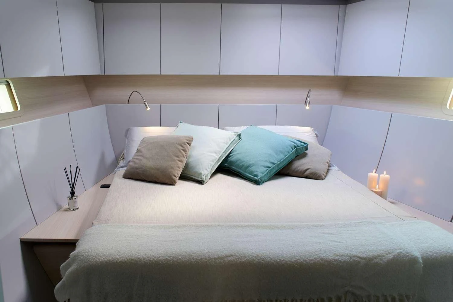 a bed with pillows aboard AORI Yacht for Sale