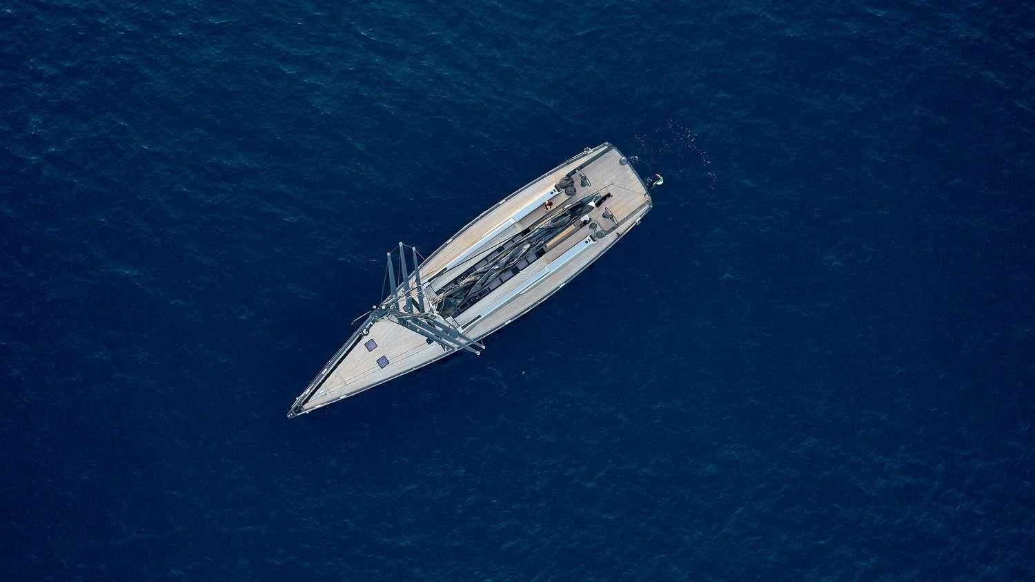 a white boat in the water aboard AORI Yacht for Sale