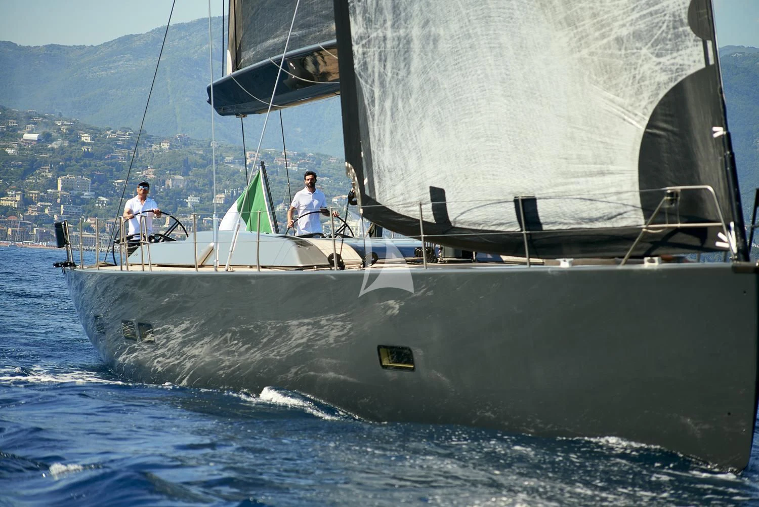 a couple of men sailing on a sailboat aboard AORI Yacht for Sale