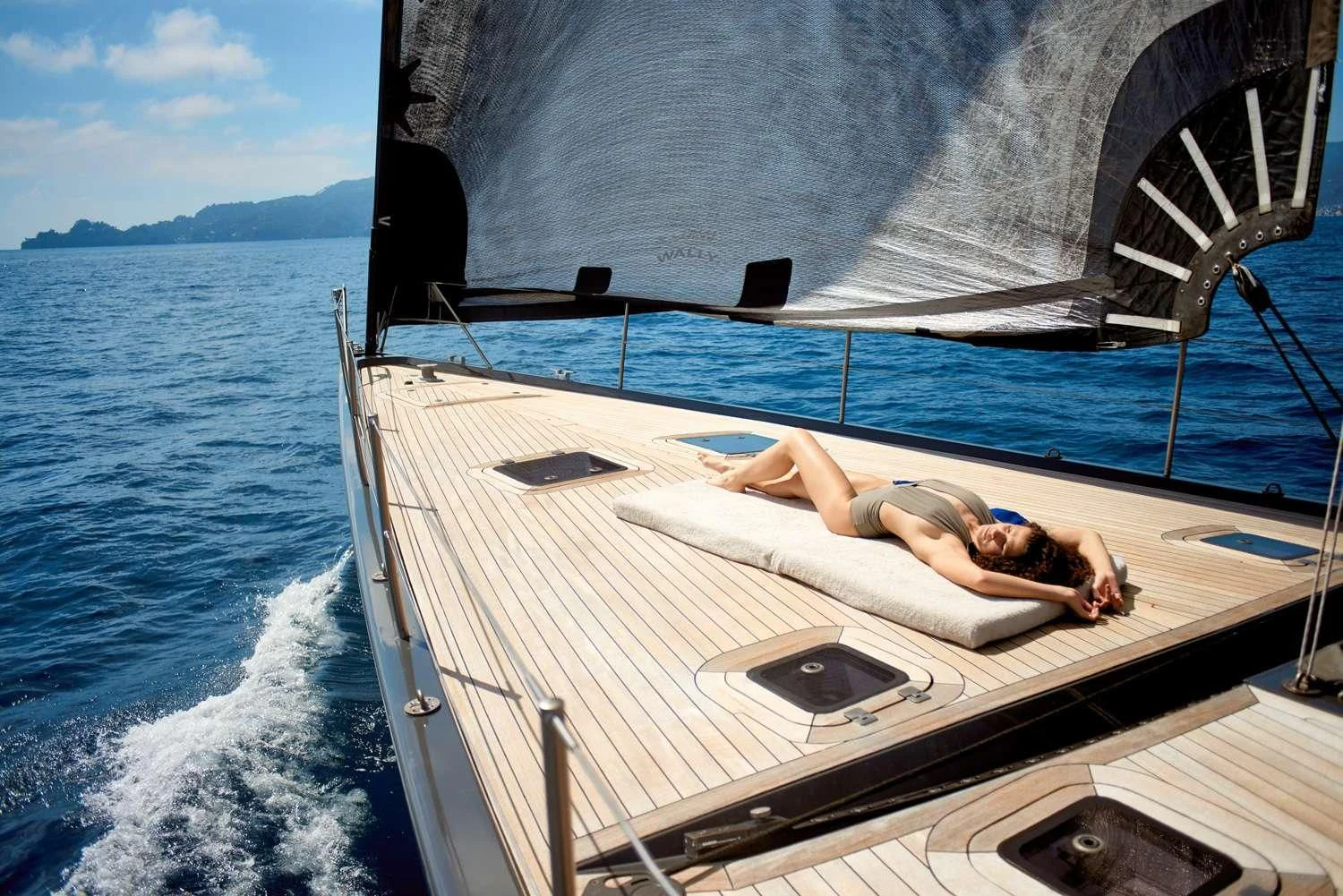 a person lying on a boat aboard AORI Yacht for Sale