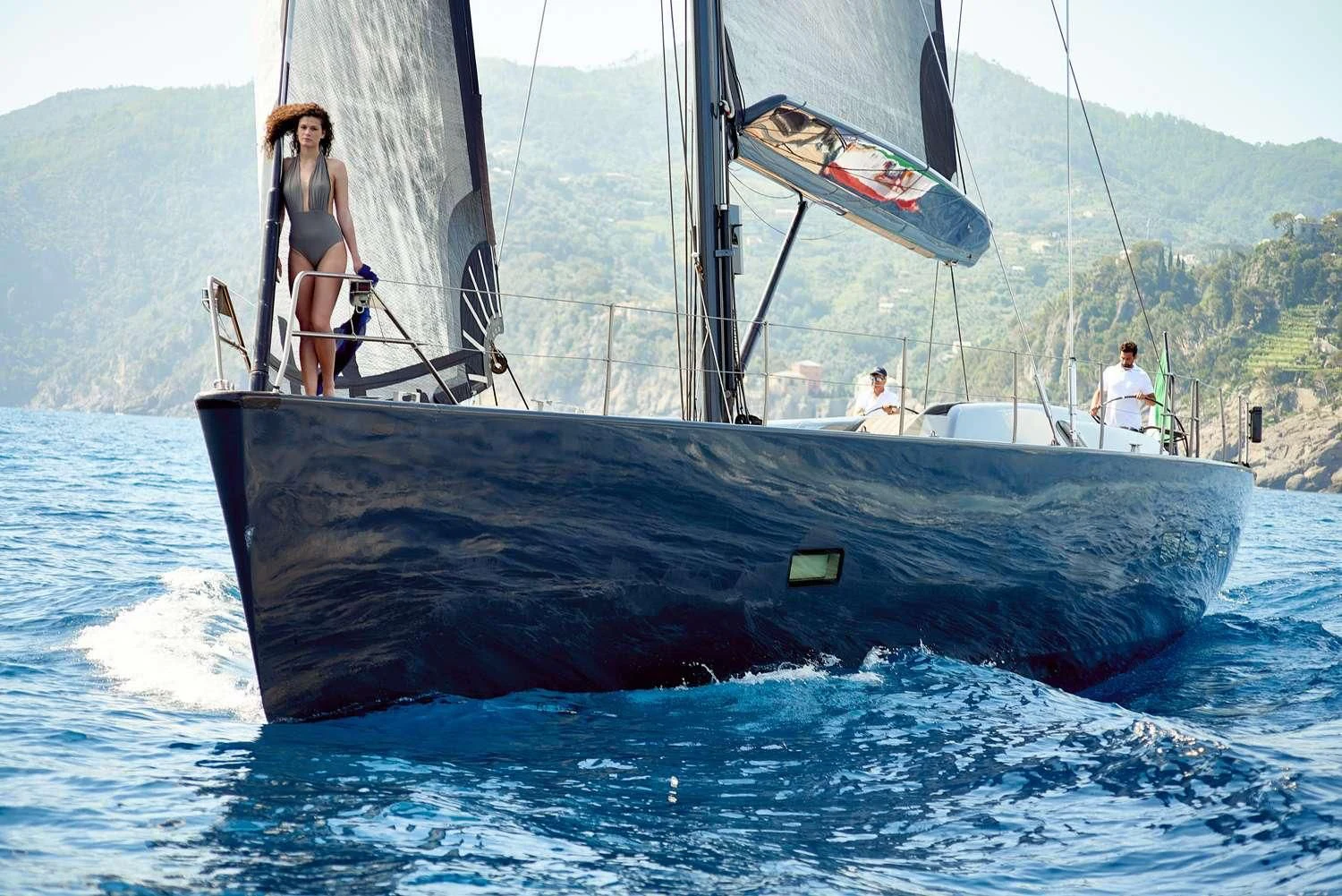 a man standing on a large submarine aboard AORI Yacht for Sale