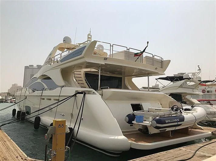 a boat docked at a pier aboard ASMAA Yacht for Sale