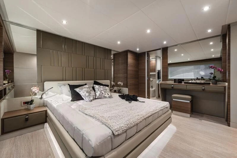 a large bedroom with a large bed aboard REBELOTT Yacht for Sale