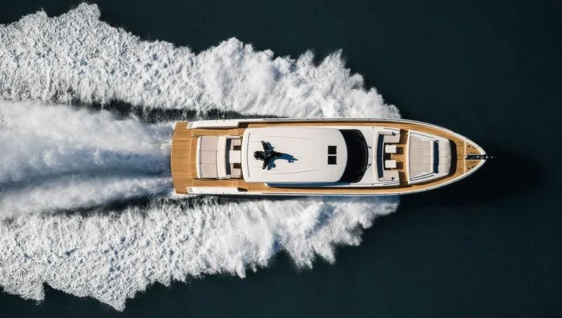 a gold and silver object with a logo on it aboard REBELOTT Yacht for Sale
