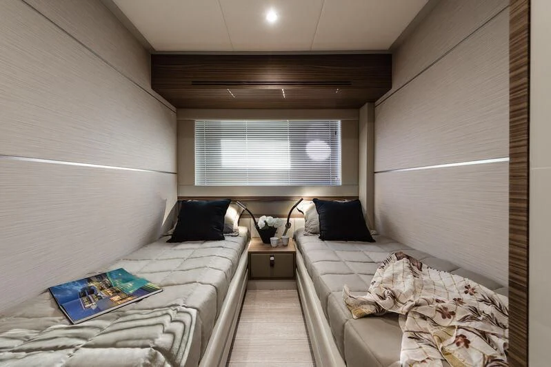a room with two beds aboard REBELOTT Yacht for Sale