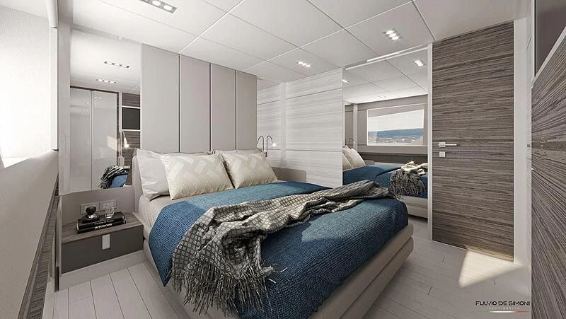 a bedroom with a bed and a desk aboard REBELOTT Yacht for Sale